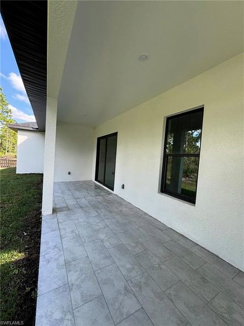 Photo of 1504 W 9TH ST, LEHIGH ACRES, FL 33972 (MLS # 2025019725)