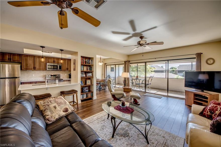 Imagine your perfect Florida getaway, nestled in a quiet, beautifully landscaped community centered around a lush tropical courtyard, a relaxing heated pool, and an inviting cabana gathering space. Just 1.5 miles from the white sand beaches and turquoise waters of the Gulf of Mexico, this meticulously maintained condo offers the ideal blend of serenity, location, and style. Situated on the elevated second floor in one of the most desirable locations within the community, the unit boasts a prime southern exposure with unobstructed views of the courtyard from a spacious private lanai. Inside, you’ll find over $50,000 in thoughtful upgrades and a bright, open living space filled with natural light and colorful tropical views. The condo is being sold fully furnished and turnkey, featuring lightly used, high-quality furnishings. The extensively remodeled kitchen and bathrooms (2022) showcase modern finishes, complemented by rigid core luxury vinyl flooring throughout. Additional updates include a new air condenser (2020), all new double pane windows (2025), new refrigerator, oven, and microwave, removal of popcorn ceilings, and fresh interior paint. The flexible floor plan offers two large bedrooms plus a den, perfect for a home office or additional guest space. Thoughtful amenities include a spacious primary closet and full-size laundry room. A highly coveted covered carport near the unit entrance is included, a rare bonus with only 24 carports available among the 64 units in the complex. Located west of Highway 41, Shore Woods is ideally positioned close to the beach, top-rated restaurants, and fresh local seafood. Community financials are strong, reserves are well funded, and recent improvements include replaced and securely anchored roofs. As a Collier County resident, owners also enjoy free parking passes at Collier County beach access points. Opportunities like this are rare — nearly flawless, move-in ready condos in prime locations don’t come along often. This is one of those moments. Add it to your must-see list, you won’t be disappointed.