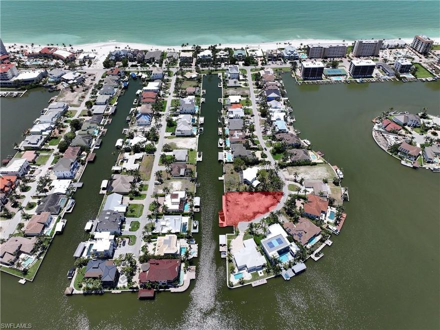 Build your dream home where boating from your backyard meets sunsets on the sand—this is Naples waterfront living at its finest.

This exceptional 0.30-acre property is tucked away at the end of a quiet cul-de-sac and offers highly sought-after southern exposure with over 140 feet of seawall. One of only 83 exclusive parcels in Naples where you can enjoy direct Gulf access from your backyard and walk to the sugar-white sands of Vanderbilt Beach—a truly rare combination.

Significant groundwork has already been done: the existing structure has been torn down, a brand-new dock with a 32,000 lb lift (built to accommodate up to a 40-foot boat) has been installed, and a variance has been approved to reduce setbacks—expanding the buildable footprint. The owner has also invested over $100,000 in architectural plans with Herscoe Hajjar Architects, offering a valuable head start on construction.

Located within walking distance to LaPlaya Beach Resort and just minutes from The Ritz-Carlton, Mercato, and Waterside Shops. Don’t miss this rare opportunity to secure one of Naples’ most desirable waterfront addresses.