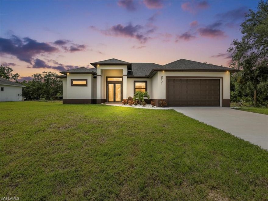 The most stunning property sitting on a HALF-ACRE LOT in the Alva–Lehigh Acres area, offering all the SPACE you could ever dream of, with room for your POOL, your RV, your TOYS, and more! Located in an AGRICULTURAL-ZONED AREA, providing the flexibility to have your TRUCKS, TRAILERS, or even SOME ANIMALS. This gorgeous home showcases an OPEN CONCEPT DESIGN with AMPLE SPACE for your DINING and LIVING ROOM, complemented by SUPER HIGH CEILINGS that create a bright and airy atmosphere. Featuring 4 SPACIOUS BEDROOMS and 2 BEAUTIFUL BATHROOMS with FLOOR-TO-CEILING TILE SHOWERS, FRAMELESS GLASS DOORS, and ELEGANT MIRRORS. The heart of the home is a LARGE KITCHEN with a WATERFALL ISLAND, perfect for cooking and entertaining, alongside a LAUNDRY ROOM complete with CUSTOM CABINETS and a UTILITY SINK. Relax in the MASTER SUITE with DUAL WALK-IN CLOSETS and a MASTER BATHROOM featuring an OVERSIZED SHOWER, a SOAKING TUB, and DOUBLE VANITIES. Step outside to a LARGE CHALET-STYLE LANAI with TILE FLOORING — the ideal space for outdoor living. This home is packed with UPGRADES including IMPACT WINDOWS AND DOORS, an EPOXY-FINISHED GARAGE FLOOR with a SIDE DOOR, DESIGNER PENDANT LIGHTS and CEILING FANS, a FULL SPRINKLER SYSTEM, and GORGEOUS LANDSCAPING. Everything you
need for luxury living is right here!