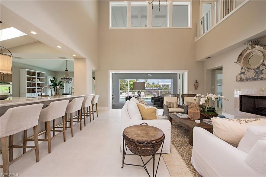 New Construction waterfront home on Crane Channel within Aqualane Shores offering Naples living at its finest with an 100 ft dock to dock your vessel, which includes direct Gulf access to the Gulf of Mexico. This 4 Bedroom, 4.5 bath home offers wood /Travertine floors over-sized heated pool/spa and large deck. Eat-in kitchen and formal dining room. Large 2nd floor covered balcony overlooking pool and canal. Two laundry rooms. Just a short .4 miles to the white sandy beaches Naples is known for or the World Class shopping and the fine cuisine restaurants on the world famous 3rd Ave S. Historic shopping district.