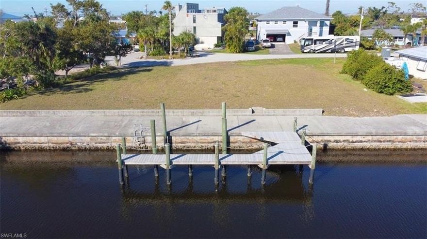 Experience true Southwest Florida waterfront living on this premium oversized Gulf-access triple-lot, perfectly positioned just 10 minutes from open water and a short, scenic boat ride to Fort Myers Beach, Sanibel/Captiva Islands, and The Gulf.
This rare property offers the ideal blend of boater’s convenience and coastal tranquility, complete with a private dock ready for your dream vessel. Whether you’re setting out for a day of fishing, island-hopping, or sunset cruising, you’ll love the quick access to the Gulf with no bridges and deep-water navigation right from your backyard.
With generous dimensions and a sought-after location, this homesite provides endless possibilities to design your custom waterfront retreat — pool, outdoor kitchen, and sweeping water views all within reach.
Situated near fine dining, marinas, and Southwest Florida’s pristine beaches, this is more than a property — it’s a lifestyle. Bring your builder, bring your boat, and start living the ultimate Gulf Coast dream!

St. James City is celebrated for its relaxed charm, friendly community, and unspoiled natural beauty. Additional features include:
Significant amount of fill/buildup in place which will save $$ on elevation materials/labor.
Cul-de-sac location on a quiet street in established neighborhood in the heart of Saint James City.
Safety and peacefulness of a canal with no through traffic.
Great neighborhood for riding golf cart, jogging, walking, with access to Saint Jude Nature Trail