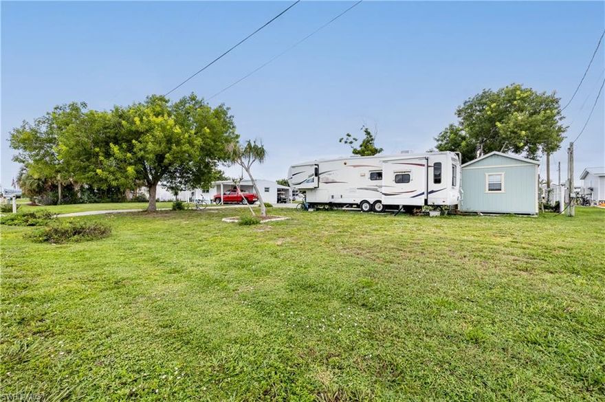 This property offers a fantastic opportunity for a fresh start in the desirable Flamingo Bay community! This lot presents a blank canvas for your new dream home. Situated on 2/3 of a full lot from the street, buyer will benefit from saving on impact fees. The property features three mature shade trees, providing natural beauty and a perfect spot for relaxation. Enjoy a generous 10' easement along the canal, where you can envision a new dock or other waterfront enhancements. The property also includes several practical storage sheds that will remain, providing added convenience. Flamingo Bay offers a welcoming community with a voluntary HOA. Membership provides access to fantastic amenities, including a recently upgraded pool, shuffleboard courts, a horseshoe pit, and a boat launch. The initiation fee is $500, with an annual fee of just $150 per person. Don’t miss out on this chance to make this space your own and enjoy all that Flamingo Bay has to offer!