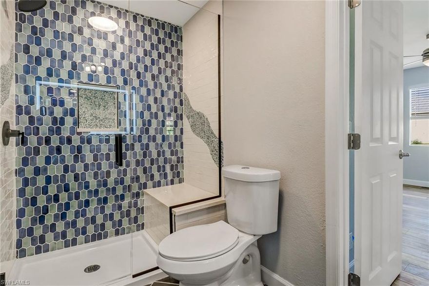 Come see this newly remodeled 3 bedroom, 2 bath home that sits on a cleared .53 acre lot.  This home features spacious bedrooms, tiled bathrooms, luxury vinyl plank flooring with new paint inside and out.  The huge kitchen has quartz counters, stainless appliances, gigantic breakfast bar and a full laundry room with wash tub. Nothing to do except move in and make the yard your own with plenty of room for a pool, garage or shop on the property.  With zoning approval, this flood zone AE, TFC2 zoned lot should allow an extra 500 square foot detached accessory apartment.  Only a mile to the Old 41 downtown Bonita Springs area that has shops & restaurants, weekly farmers market, new public library, and Riverside Park with many live music events. Situated less than 5 miles to Barefoot and Bonita beaches and a quick drive to RSW airport.