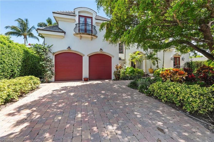 Be transported to the South of France in this elegant and charming family home with impeccable detail and style. Located on a prime street in Park Shore, this spacious four-bedroom-plus-den, four-and-two-half-bath home features a grand great room entry with soaring ceilings, chef's kitchen with oversized center island and multiple dining options, a La Cornue gas range with overhead exhaust hood, finely crafted Habersham custom cabinetry, a main-floor primary bedroom with spa-like bath featuring standalone soaking tub and dual vanities. Custom wrought iron railings on the tile adorned staircase lead up to a second-floor large landing area and three more guest bedrooms and baths. Bonus storage space fully air conditioned. A south-facing saltwater pool with new saltwater system receives an abundance of daily sun and the spacious tiled patio is perfect for entertaining and enjoying indoor outdoor living. For car enthusiasts, the two-space garage has ceilings high enough for a lift. Located blocks from the beach, shops, and restaurants and with available Park Shore Beach Park access.