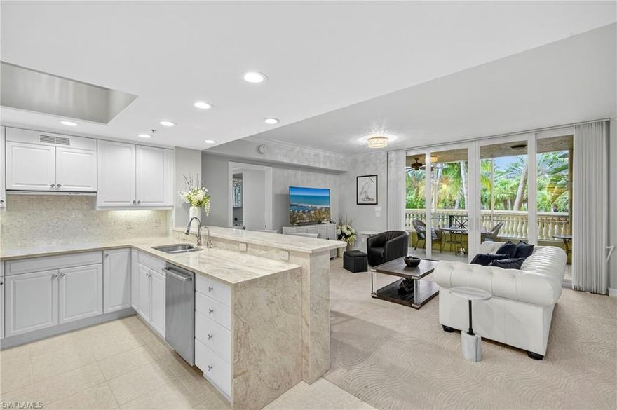 Thoughtful quality, beautiful decor and an expansive balcony (OVER 1000 SF) are highlights of this fabulous features of this well appointed FURNISHED Ventanas condominium in The Ritz Carlton Tiburon Golf Resort.  Mornings and evenings can be enjoyed on the spacious screened lanai while the day can be filled with soaking up the sun on the huge balcony or by one of the two swimming pools Ventanas residents enjoy. Neutral colors complement the interior as does the remodeled primary bath.  Guests will enjoy their own full bath, too. The dining area is currently used as a home office.  One deeded parking place and ab air conditioned storage unit are bonuses. Gas grills are available poolside for residents. Tiburon offers many membership options but none are mandatory for this condominium. Tiburon is conveniently located close to several restaurants, shopping, the Gulf beaches and Mercato.