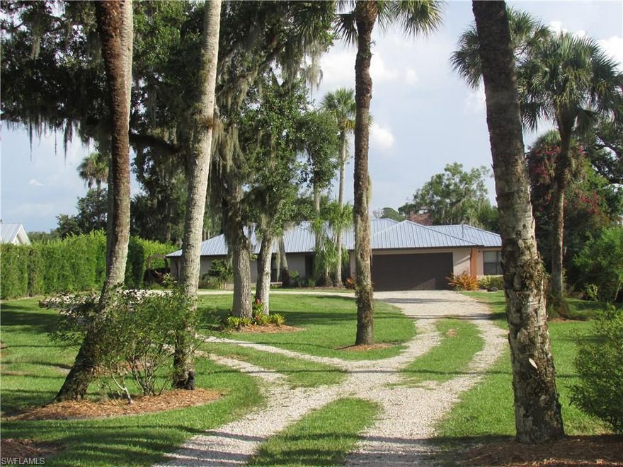 Come home to the serenity of Labelle with majestic oaks dripping in Spanish moss and live 18.3 ft above sea level! This well maintained 3+/3 is a gem.  Very private home setting offers plenty of space with fantastic views of the Caloosahatchee river.  The home offers options with a unique layout for your needs.  Purchaser has either 2 owner suites with sitting areas, 4 bedrooms, or rental income with separate entrance.  Upgrades include new metal roof, new gutters, solid wood kitchen cabinet with granite, new yacht pilings at dock, updated master bath with large soaking tub and granite, cork flooring,  stainless steal appliances, working fireplace, and high-end window treatments.  Beautifully landscaped with mature fruit trees, majestic oaks, and flowering butterfly attracting gardens an oasis awaits for you here.  If you want to enjoy the Florida lifestyle, this home delivers.  Park your yacht or sailboat on your tree lined deep water gulf access river front home.  Living on the Intracoastal Waterway gives you access to the world.  Fish from your private dock, or take a sunset cruise.  This is the real Florida life. Very special.  Come home to your River Retreat!