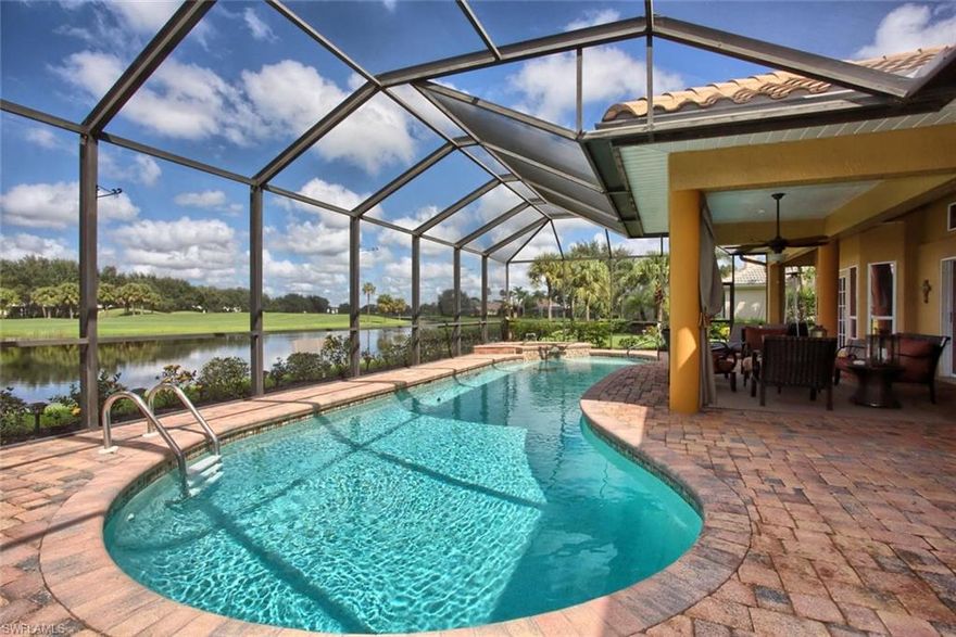 LOCATION! LOCATION! LOCATION! One of the best location in all Gateway if not the best. This magnificent waterfront home with its oversized 1420 sq ft lanai with view on the 18th hole of the famous Tom Fazio golf course voted the best 18th hole in all SWF. If you are looking for a great open floor plan with a magnificent views and privacy, look no more, here it is. Please note that the last two owners spent $187,000 on top-of-the line upgrades such as a brand new roof, Acadia Scraped Wood Flooring throughout, granite everywhere, raised wood panel cabinetry, stainless steel appliances, convection microwave and oven, oversized master shower with multiple heads, master closets built-in, each guest suite has pocket door and their own bath, propane fireplace, pool & spa have solar and electric heat, interior system to adjust the pool and spa, brick pavers in the lanai and driveway etc... All in all, all was done so you can enjoy this home immediately. Come and visit, you will be impressed. The community boasts two manned gates and 24-hour security roaming patrol. All different membership options including social and golf (specially priced until 12/31/16) are available but not mandatory.