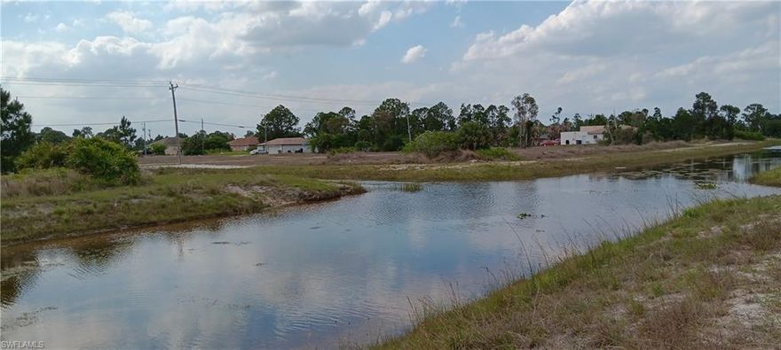 This mostly cleared lot is located in a quiet community of Lehigh Acres with a fresh water canal on two sides.  This is not a flood zone and lot is high and dry. Newer homes are being built in this area which brings added value to your investment or future dream home.