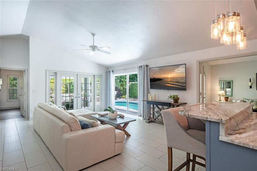 Welcome home to this immaculate private villa with pool! NEW ROOF 2019. Remodeled in 2015 gorgeous granite counter tops, Cabinets, Master Bath completely redone and walls removed to open up floor plan. This 2 bed +den (3rd bed possible just close in closet). Attractive plantation shutters grace all windows/sliders, and volume ceilings enhance the spacious open feel. Other updates include a Whole home water filtration and reverse osmosis. Architectural interest abounds with plant shelves, French doors, and glass block windows in the bathrooms, plus a skylight in the master bath with dual sinks for abundant natural light. The kitchen is bright, spacious and open. Enjoy your sunny lanai (The pool deck redone in 2017 travertine) with sought-after SE exposure and pool access from the living area or master bedroom! Cable/phone/internet, lawn/landscaping and irrigation are included in the quarterly fees, as well as Vineyards gate access. Large grassy common area with pavers and seating (great for hanging out with neighbors) right across the Villa Verona street is perfect for kids or pets, as well as extra guest parking across the street.