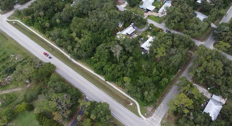 Corrected info from the county: "to accomodate well and septic, lots must be a minimum of 1/2 acre each"  There could be one shared driveway on CR 78 or one on CR 78 and one on the side road to accomodare the corner lot.  1108 County Road 78 is in flood zone X.   Will require a $150 parcel split fee plus a survey showing the layout of the lots.  Well and Septic will be required.  Sidewalks are in,  Across from river, only minutes away from county boat ramp, riverfront park and restaurants.  Recently re-certified surv on hand.  Call today this one won't last long.