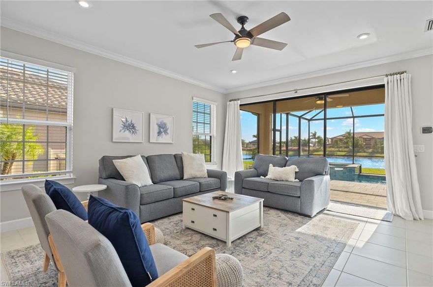 Experience refined Florida living in this newly built 3-bedroom + den villa in Esplanade by the Islands. This open-concept layout is full of upgrades including tile flooring, quartz countertops, and added LED lighting throughout. Enjoy cooking on your gas stovetop in one of the few natural gas communities in the area! Step outside to your private outdoor retreat featuring a sparkling pool and heated spa with beautiful water views — perfect for relaxing or entertaining year-round. With highly desired southwestern rear exposure, you’ll enjoy abundant natural light throughout the day and breathtaking Florida sunsets from your own lanai. Life at Esplanade feels like a permanent vacation. Residents enjoy a resort-style pool with private cabanas, a poolside Bahama Bar, a state-of-the-art fitness center with a full calendar of group classes, an on-site salon and spa, satellite pools, and a dedicated dog park — all within a vibrant, amenity-rich community. Ideally located just minutes from the pristine beaches of Marco Island, the natural beauty of the Everglades, and the world-class shopping and dining of 5th Avenue South in Naples, this villa offers the perfect blend of comfort, modern design, and effortless Florida living you’ve been dreaming of.