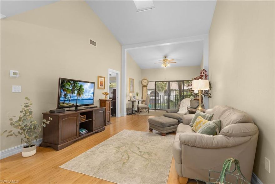 Vaulted livingroom ceiling and a fabulous view. Must see immaculate condo centrally located in a quiet complex. Catalina at High Point is located in a non - gated PET FRIENDLY * community located adjacent to High Point Country Club in Naples, Florida. Not only is it just 1 mile to the beach, but it is also steps away from a PRIVATE COUNTRY CLUB that allows an associate membership for 2 people for less than $3500!That means access to GOLF for 2 people and access to all of the other amenities the private club offers within walking distance of your front door! This location is a true hidden Gem! 
This condo has a warm tone welcoming ambiance. It has a vaulted ceiling that includes a skylight in the living room. The ac and tankless water heater are less than 5 years old. The bamboo flooring is in pristine condition. The kitchen boasts quartz countertops. The primary bathroom has and oversized walk in shower and the primary bedroom has a huge walk in closet. This condo even has a covered parking structure that includes a large private storage room that locks for outdoor items like bikes and golf clubs.
*1 pet less than 20 pounds