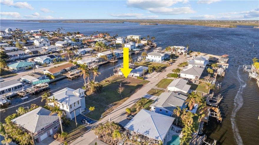 This Waterfront Lot is located on a 100ft wide canal, with Direct Access/No Bridges and only 5 lots away from Matlacha Pass!! Enjoy Matlacha living at it's best! This lot is ready for your new Florida Dream home!.  Walk or bike to all Matlacha has to offer. You are just a short stroll to restaurants and shops. Public water and sewer are available/to be hooked up by buyer.