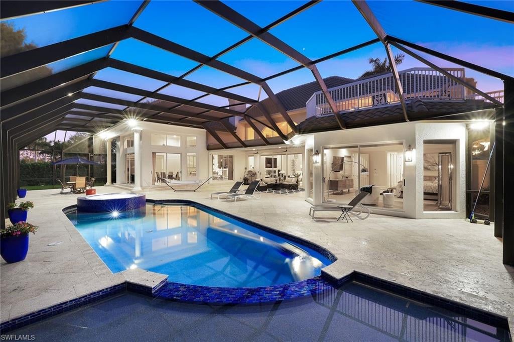 Photo of 12924 Bald Cypress LN, NAPLES, FL 34119 (MLS # 226008934)