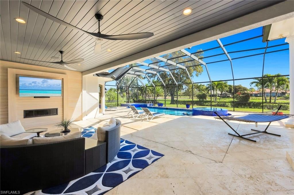 Photo of 12924 Bald Cypress LN, NAPLES, FL 34119 (MLS # 226008934)