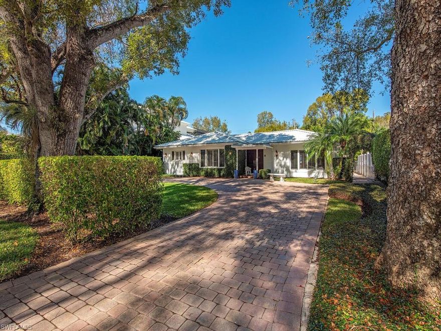 H4440 - The ultimate in location!  Nestled on a quiet, tree-lined street only a few doors from Naples' pristine beaches and a short walk to all that Downtown Naples has to offer, this charming residence and guest house have been meticulously maintained throughout the years.  The interior of the residence, both bright and cheery, features bamboo floors, plantation shutters, crown molding, as well as three spacious bedrooms, each with a designated bathroom.