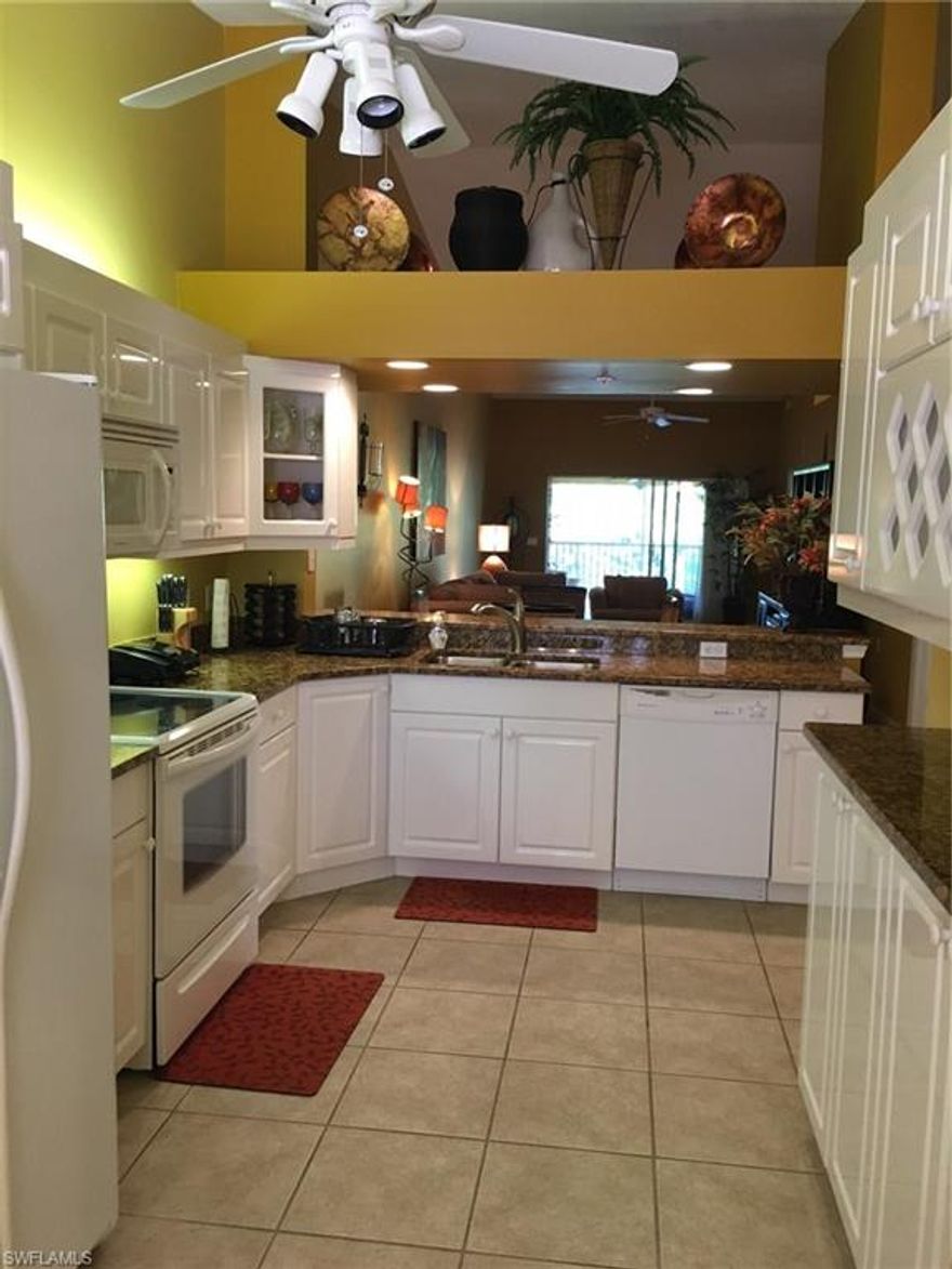 Richly appointed and designed for total comfort, this three bedroom, two bath end unit is situated in a quiet section of the highly desirable Falling Waters community. You will be impressed with the lovely granite Kitchen counters and white cabinets, upgraded appliances and even a built-in wine rack. Over-sized tile in all rooms except the three bedrooms ensures ease of care and maintenance. The huge Master Bedroom seamlessly accommodates a king-sized bed with plenty of room for other furniture. The adjoining Master Bath has dual sinks, large walk-in shower, and separate water closet. A wrap-around lanai faces a landscaped area with flowering trees and shrubs, creating a perfect place to relax with your favorite beverage at the end of a fun-filled day. This unit has a detached one car garage just a few feet from the front door. Falling Waters, with its many waterfalls along the main road of the community, has a huge resort-like pool and a newly decorated Clubhouse. Approximately six miles east of Downtown. Naples is renown for it's exciting restaurants and world-class white sandy beaches.