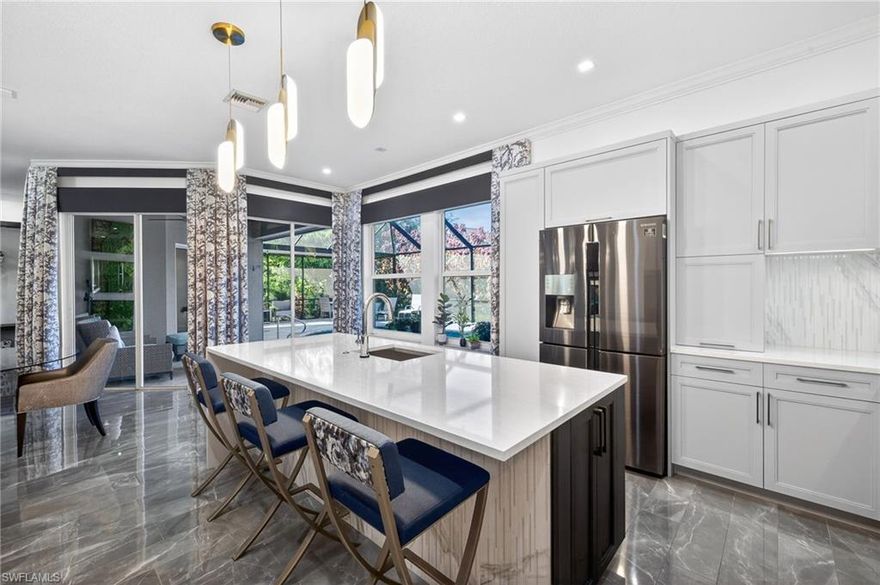 This home isn’t just updated, it’s been completely reimagined from the ground up for someone who truly appreciates DESIGN, DETAIL, and QUALITY. Every inch has been thoughtfully remodeled, floor to ceiling, with a sleek, modern aesthetic that feels both elevated and comfortable. It’s the kind of one-of-a-kind makeover by the prestigious Designer Dwayne Bergmann Interiors where nothing was overlooked and every finish feels intentional, including customized finished walls throughout the home that add subtle texture, depth, and unexpected design surprises.  This stunning home is being offered with over $200,000.00+ curated, UPSCALE specialty furnishings, this home is truly move-in ready. The experience starts before you even step inside. As you approach the front door, you’re welcomed by a peaceful butterfly garden and waterfall pond, an unexpected and memorable first impression that sets the tone for what’s inside. This is a 3-bedroom PLUS den home with one beautifully designed en-suite bath and a separate guest bath, offering flexibility for visitors, work-from-home, or creative space. Each bedroom has been fully updated, featuring refined finishes and a calm, cohesive design that makes every space feel polished and inviting. The kitchen is a fresh, chef-inspired showpiece that balances style and function, ideal for everyday living and entertaining alike. The main en-suite feels like a private spa, complete with a curbless walk-in shower and calming, modern finishes. Outside, the living space continues with a newly resurfaced and expanded pool and spa, surrounded by an extended screened lanai. Smart Living & Outdoor Enhancements: Automated pool system, low-voltage landscape lighting that highlights the butterfly garden and outdoor spaces, and automated window shades throughout, adding ease, ambiance, and everyday convenience both inside and out. The home sits on a slightly larger lot, thoughtfully positioned to provide added privacy from neighboring homes. Gourmet Garage: Finished to the same high standard as the home, featuring a professionally coated floor,  clean, polished, and perfect for storage, hobbies, or simply parking in style. Impact windows, hurricane shutters, and a whole-home generator with a buried propane tank deliver peace of mind without compromising design. If you’re detail-oriented, design-focused, and looking for something truly special, this home stands in a class of its own. This spectacular home is located across from Caloosahatchee River in Riverside Yacht Club Estates, which offers its own separate MARINA and a PRIVATE ISLAND, perfect for viewing our beautiful Florida sunsets.  An optional Landings Yacht, Golf, and Tennis Club membership is also available.