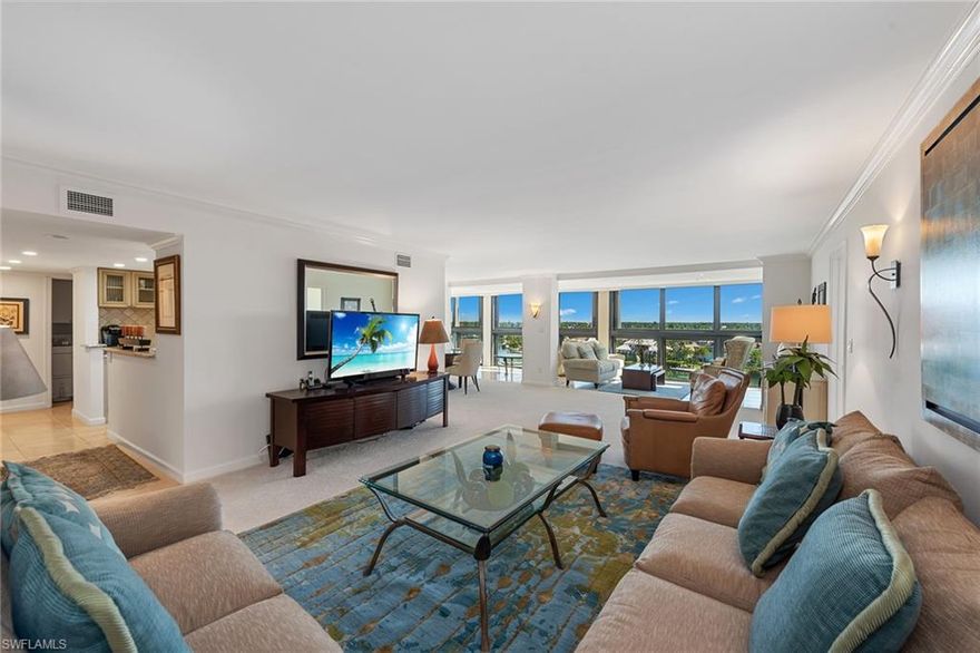 With a spectacular seventh floor view of Moorings Bay, direct boat access to the Gulf and 10 acres of gorgeous beach and bayfront property, you simply can't ask for more. This renovated home has a Bay view from every room, an enclosed lanai with a wall of impact resistant glass, under-building garage parking space and plenty of storage. The kitchen was opened up to take advantage of the view and features stainless steel appliances, wine cooler, timeless cabinetry and granite countertops. Beautiful stone-like ceramic tile and carpet spans throughout the home, Hunter Douglas shades provide privacy, and the guest room is functional with a built-in desk and Murphy bed. Wake up in your spacious master suite to the colorful sunrise and incredible sights of dolphins. Admiralty Point runs along Doctors Pass, offering extensive lifestyle amenities including boat docks, two clubhouses, fitness facility, 2 Har-Tru tennis courts, a kayak launch, 24-hour security and guarded gate, vehicle wash station, and even a kiddie pool. Unique to Admiralty Point, residents also enjoy both sunrise AND sunset pools and spas to take full advantage of the scenic beauty from morning to night.