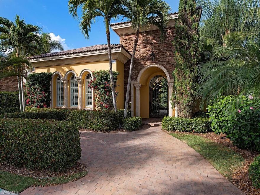 A grand Corinthian column accented courtyard entry welcomes you to this magnificent villa residence. A stunning gas fireplace in the formal living room creates a fantastic focal point while the lush green golf course views flood the space through the bank of French doors opening to the screened lanai and sparkling pool.  An abundance of exceptional appointments are found throughout including custom lighting, volume ceilings with coffered detail, crown moldings, French doors, arched passageways and natural stone flooring throughout the main living areas. Upgraded built-in appliances, raised wood panel cabinetry, custom stone backsplashes and pendant lighting are found in the open chef’s kitchen with granite counter tops on the work surfaces and center island. Retreat to the master suite featuring a sitting area in the master bedroom with striking golf course views and direct outdoor access. The expansive screened lanai is highlighted by an elevated spill over spa cascading into the tropical pool. Enjoy lounging around the sunlit paver deck or relax under the Corinthian column flanked loggia alongside the summer kitchen with captivating golf course views as the perfect backdrop.