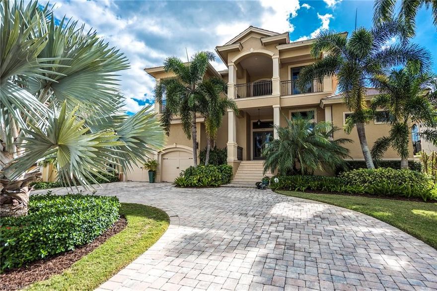 Ideally sited in one of Naples’ most desirable locations close to Third Street South and Naples Bay, this captivating four bedroom plus a den, five bathrooms waterfront residence is one to be desired. Positioned with southern exposure, this boater’s dream spans over 4,300 square feet of open living spaces that transition effortlessly to the outdoors. Wood floors, volume ceilings, a gourmet chef’s kitchen with well-appointed appliances such as Viking gas range, and Sub-Zero refrigerator, a spacious first-floor master suite, and private study are just a few of the highlights of this extraordinary home. Three large en suite guest bedrooms upstairs with separate loft area and covered balconies provide extra comfort for family and guests. A covered lounge area with fireplace and summer kitchen with Lynx grill, flow to a private heated pool and spa. A boat dock with 24,000 lb. lift is poised with no bridges to the open bay for a true boater's dream.