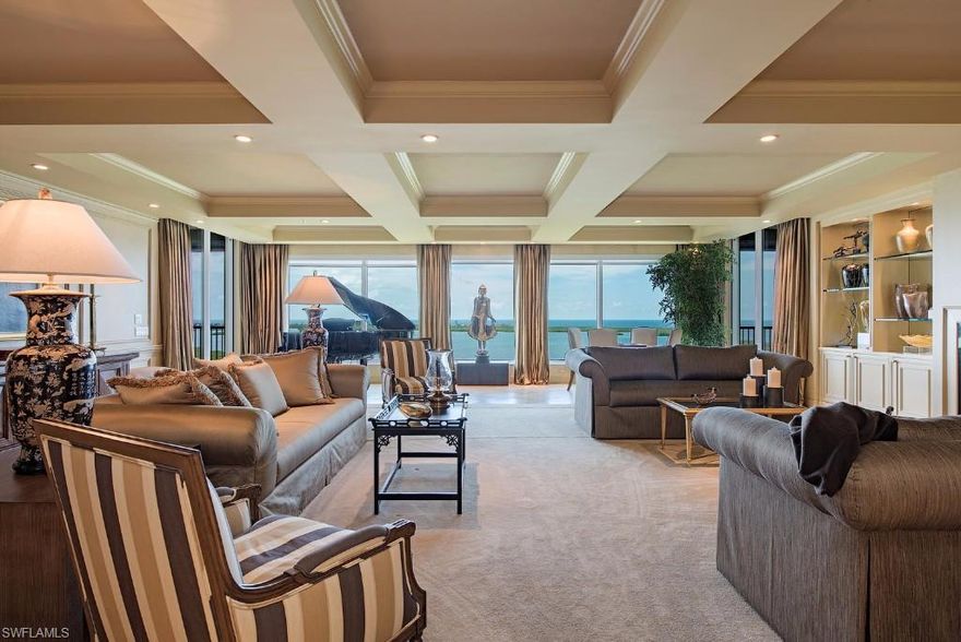 $200k Price Reduction. Professionally decorated by Howard Litton design group, this exquisite 20th floor penthouse of almost 6000 SF (7,000 with lanais) will envelop you in soft warm transitional tones. A large family room opens to a Chef’s kitchen and one of two large screened lanais. Kitchen features built in appliances including a gas cooktop.  Wine lovers will marvel at the custom 458-bottle glass door cooler.  3 AC’s, 2 Dishwashers, 2 water heaters, and washer dryer all new in last 3 years.  A cavernous grand salon and dining room overlook the Gulf and Estero bay from a wall of floor to ceiling glass.  Master bedroom is a tranquil retreat with spacious spa bath opening to screened lanai.  A den and two more guest rooms complete this perfect home. Unit is being offered furnished with many pieces updated by Howard Litton Designs in last year. Private 2 car garage with AC storage.  Recent building renovations by Clive Daniel in this magnificent waterfront Palermo tower are complete. Colony amenities include the  waterfront Bay Club featuring two levels of dining and boat access to your private 34-acre island beach park.Golf is optional at the newly renovated Colony Golf Club