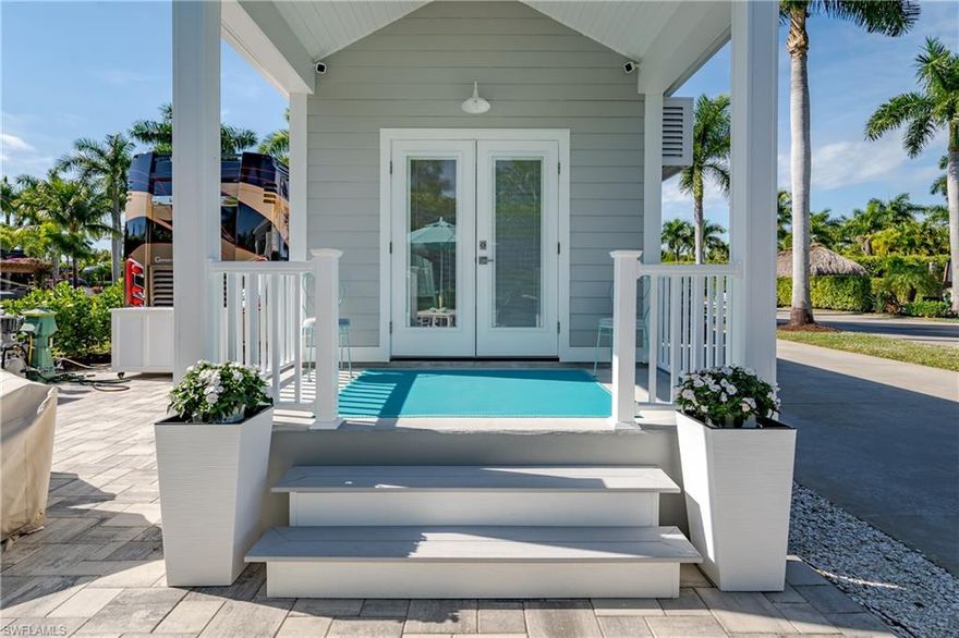 Lot 111 - Welcome to Naples Motorcoach Resort – Your Private Oasis in Naples, Florida

Welcome to the beautiful gated community of Naples Motorcoach Resort, where luxury, tropical beauty, and lifestyle come together seamlessly. As you approach the gates, you are welcomed by vibrant flowers and elegant fountains setting the tone for what lies beyond. Once the gates open, a magnificent fountain and lush landscaping frame the circle drive of the clubhouse, creating a truly grand arrival.

You turn left, then immediately right, and make your way to your personal oasis. Backing your coach into place, you instantly feel it—you’ve arrived in paradise. After setting up, you step outside into your private sanctuary, where gentle breezes and the soothing sounds of nature invite you to relax and unwind, surrounded by beautifully designed landscaping.

Entertaining comes naturally here. You decide tonight is perfect for hosting friends. Inside your well-appointed casita, you prepare for the evening—perhaps a martini tasting, fitting for the resident martini expert. A few signature cocktails are chilled, charcuterie boards are artfully arranged, and once again you admire this exceptional space. The casita offers a comfortable living area with a pull-out sofa, calming wall colors, and a thoughtfully designed kitchen with a striking tile backsplash that perfectly complements the countertops and flooring—clearly the work of a professional decorator. One of the standout features is the spacious, spa-like shower, offering comfort and luxury rarely found in motorcoach living. Freshly painted interiors and updated lighting further enhance this inviting retreat.

Naples Motorcoach Resort is a boutique, Class A–only luxury resort, offering an unmatched array of amenities. Residents enjoy a stunning infinity-edge pool and spa, fitness center, men’s and women’s saunas, pickleball courts, and a clubhouse with a catering kitchen available for private events or resort-sponsored gatherings. Two additional satellite pools—each with its own spa, restrooms, and laundry facilities—provide convenience throughout the community. And for your furry companion, there is even a dedicated dog park.

Perhaps the most unique and sought-after feature is that Naples Motorcoach Resort is the only Class A motorcoach resort in Naples with its own inside-the-gates Gulf access via a community boat ramp. Don’t have a boat? No problem—take advantage of the community kayaks and explore the surrounding waterways, cruise toward the Gulf, stop at nearby islands, and enjoy the abundant wildlife that makes this area so special.

The options are truly endless in this tropical paradise.
Call today and make your Naples Motorcoach Resort dream a reality.