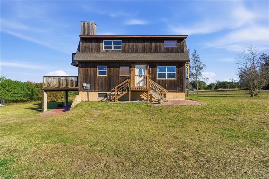 Experience the lifestyle you’ve been dreaming of with this elevated 2-bedroom, 2-bath riverfront home nestled along the scenic Peace River, just 15 minutes from downtown Punta Gorda. Surrounded by protected wildlife and natural beauty, this property offers privacy, tranquility, and true Old Florida charm—while remaining conveniently close to shopping, dining, and waterfront attractions.

The main living area is elevated and has never flooded, providing added peace of mind. An expansive porch extends your living space outdoors, creating the perfect setting for morning coffee, evening gatherings, or simply enjoying peaceful river views. Inside, the open-concept layout allows the kitchen to flow seamlessly into the living area and out to the porch—ideal for both everyday comfort and entertaining.

The home features two bedrooms and two full baths, including an oversized bathroom with potential flexibility to convert into a third bedroom or reconfigure to suit your needs. Recent improvements include new windows, impact-rated sliding glass doors, updated appliances, and a new electrical panel—offering move-in-ready convenience and long-term value.

A rare open-sided lower-level basement provides exceptional bonus space for a workshop, storage, hobby area, or recreational retreat. Adding to the appeal, a community boat ramp and clubhouse are located just two blocks away—making river access, boating, and neighborhood gatherings both easy and convenient.

Whether you’re seeking a seasonal getaway, full-time residence, investment opportunity, or remote-work escape, this riverfront property delivers versatility and lifestyle appeal. A buyer credit further enhances the opportunity to make this unique waterfront retreat your own.