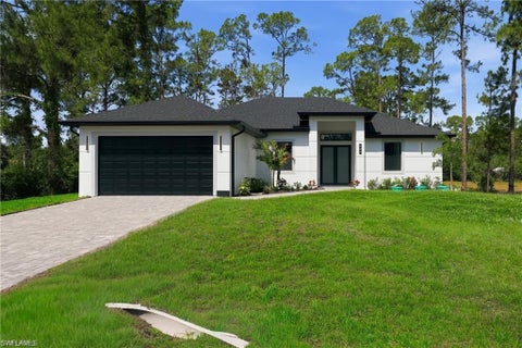 Photo of 303 McArthur AVE, LEHIGH ACRES, FL 33936 (MLS # 226028482)