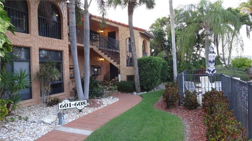 Wonderful bright and sunny corner unit across from the sparkling pool and relaxing Spa.  This condo feels more like a home than a condo.  Located in the popular Rose Garden area just down the street from Tarpon Point where you can enjoy the restaurants, shops, marina and luxury hotel.  Rotary Park is literally across the street and offers, bike paths, boardwalk, dog park, butterfly house and a preserve with nature trails. Needless to say this is the area to live in and enjoy the Florida lifestyle.  This spacious condo has an Updated kitchen with pantry and breakfast bar. Window over the sink overlooks the pool. Formal dining area.  Open floor plan with high ceilings.  Two bedrooms and two bathrooms.  Master bathroom has walk-in closet in addition two other closets and a Long Double Sink vanity.  Inside laundry room.  Covered parking and guest parking.  Fully furnished, first floor corner unit.