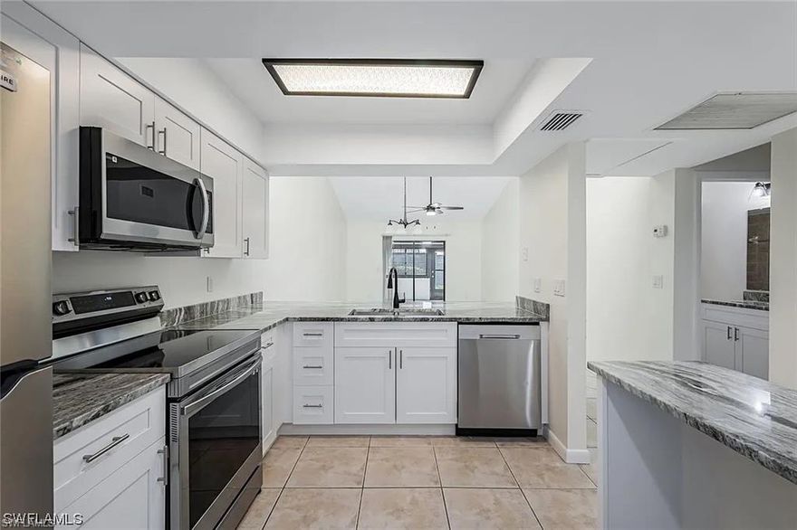 Short Sale. Remodeled First Floor End Unit in SW Cape Coral. Fully remodeled and move in ready 2 bedroom, 2 bathroom first floor end unit located in the heart of Southwest Cape Coral. This bright corner unit offers added privacy, easy access, and an assigned parking space.

The updated kitchen features stainless steel appliances, new cabinetry with soft close doors, granite countertops, double sink, and a built in desk area. Both bathrooms have been renovated with matching vanities and granite tops. The primary suite includes a walk in closet with built ins and sliding doors to the outdoor living space. Tile in main living areas, laminate in bedrooms, and washer and dryer included. Walking distance to the Cape Coral Public Library and just a short drive to beaches, shopping, dining, schools, and hospitals.

Great opportunity for a primary home, seasonal retreat, or investment