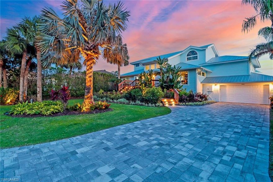 Live the ultimate Naples waterfront lifestyle in this stunning coastal contemporary elevated pool home perfectly positioned at the end of a quiet cul-de-sac in Vanderbilt Beach. 
With preferred southern and westerly panoramic bay views from this oversized lot capturing the essence of elegant coastal living with spectacular sunsets. Step inside and be captivated by the light-filled open layout, soaring ceilings with designer wood beams, and expansive water views from nearly every room. The gourmet kitchen has custom cabinetry with quartz tops, 2 SubZero freezer drawers in the butlers pantry and professional-grade appliances, 80-bottle wine cooler, a dream for any chef. Spacious 3 bedrooms + den/office and 4.5 baths, including two primary suites one on each level. Each bedroom is ensuite, with a new main-level owner’s suite and spa-style bath. The upper-level suite features a private balcony overlooking the bay, perfect for morning coffee or evening sunsets. Or Consider repurposing the upstairs second owner’s suit into a multiple bed dorm area for kids or grandkids to have as their own sanctuary.  Enjoy your private resort-style oasis complete with a heated pool, fire pit, lush tropical landscaping, and dramatic lighting. The grandfathered-in covered boathouse complete with 15,000 lb lift with an upper observation deck is truly one of a kind—ideal for entertaining, dining under the stars, or simply taking in breathtaking views of the wide bay. The climate-controlled two-car garage includes custom cabinetry, a sink, refrigerator and additional storage. All living areas are elevated above flood levels, with water-resistant finishes for peace of mind. This is more than a home—it’s a lifestyle. Walk or bike to white sugar sand Beach, The Ritz, LaPlaya, Turtle Club, and Mercato for world-class plethora of dining and shopping. Watch the dolphins play, the pelicans glide, and sunsets light up the bay. The ultimate in boating from your own backyard. Home could be offered turnkey furnished.