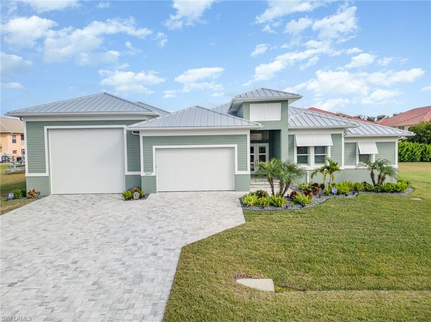 Prepare to be amazed by this one-of-a-kind luxury **RV-garage home** in the heart of SW Cape Coral, offering an unmatched combination of elegance, storage capacity, and true Florida lifestyle living. Designed for the automotive enthusiast, this property features a **50-ft deep, 25-29-ft wide custom RV garage** capable of parking up to six cars comfortably, in addition to the full two-car garage—with the ability to install a car lift and double-stack additional vehicles, making this a rare opportunity for collectors who demand space, security, and function. Behind the **RV garage is a 37-ft extended custom paver pad, ideal for additional parking, a boat trailer, jet skis, or outdoor workshop space.** Step inside to a beautifully upgraded home featuring custom blinds throughout, luxury finishes, high ceilings, and a thoughtfully designed split floor plan offering privacy and comfort. The open-concept kitchen includes premium cabinetry, spacious island seating, upgraded appliances, and overlooks the expansive great room with tray ceilings and elegant built-ins. The primary suite impresses with its spa-like bathroom, oversized walk-in shower, and a massive open closet layout designed for true livability. Step outside to your private tropical retreat, complete with a sparkling saltwater pool and spa, stunning paver lanai, and plenty of room for entertaining or relaxing under the sun. Additional upgrades include spray-foam insulation, instant hot-water recirculating system, smart home features, full alarm system with motion/window/door sensors, Bluetooth irrigation, high-speed mesh Wi-Fi across the entire property, attic storage access points, and multiple mini-splits for efficient temperature control—including two in the RV garage, one in the primary bedroom and the fourth in a guest bedroom.**** Designed for full-time residents, seasonal owners, or those seeking a high-performing rental, this home offers outstanding security features for locking off the primary suite and RV garage from guest-accessible areas.**** Located in one of Cape Coral’s most desirable neighborhoods, you are minutes from waterfront dining, live music, marina, pickleball courts, parks, and walking trails. Whether you’re an RV traveler, car collector, boater, or someone who simply appreciates exceptional craftsmanship, this property delivers a level of storage, comfort, versatility, and sophistication rarely found in one home. This is more than a house—it's a lifestyle, and an opportunity you won't find anywhere else.