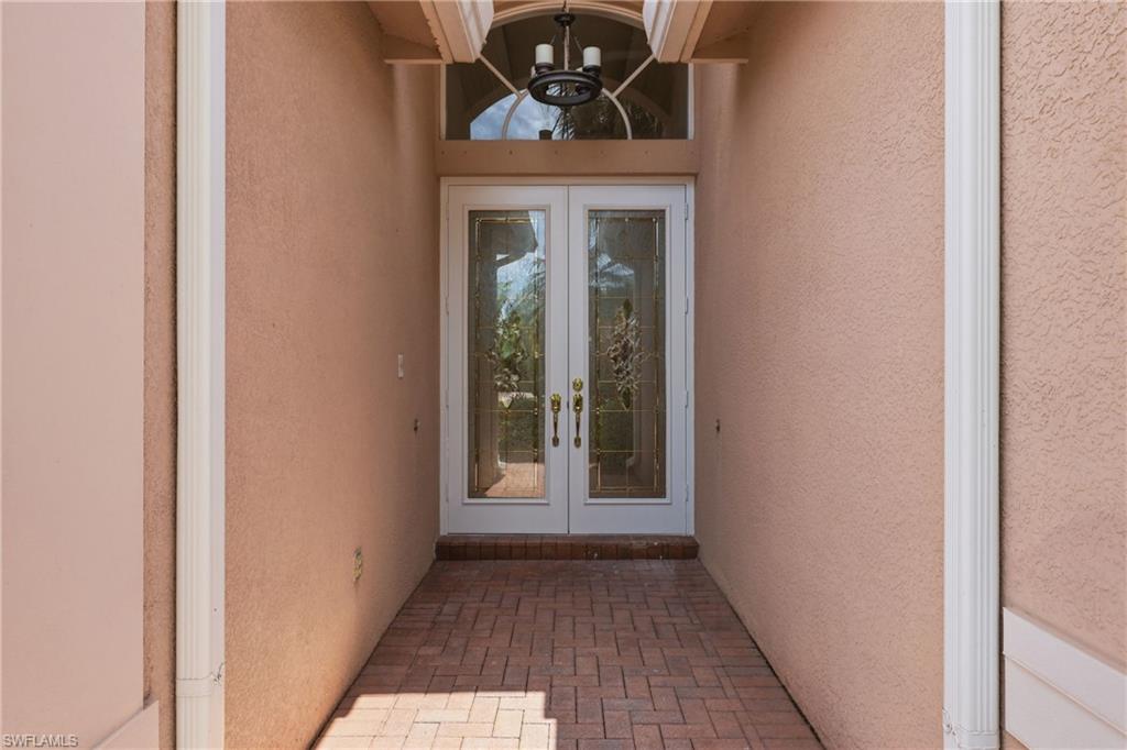Front entrance of home in Saturnia Lakes, Naples Florida real estate listing.