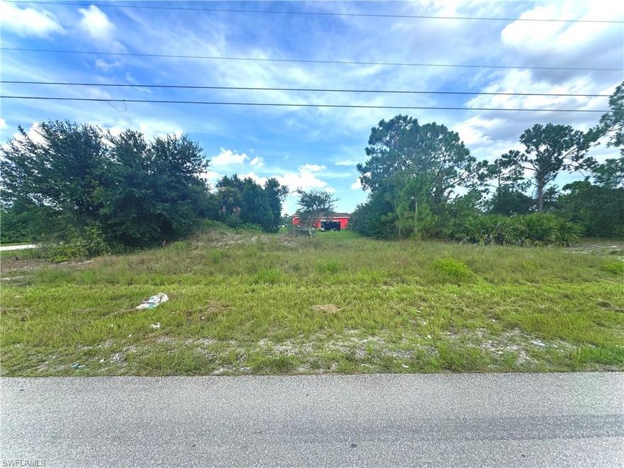 GREAT LOCATION CORNER lot MOSTLY CLEAR in the HIGHLY DESIRABLE SW side on a quiet paved street with utilities! Just minutes from major amenities with a quick commute to Fort Myers! Come build your DREAM HOME or INVEST today!