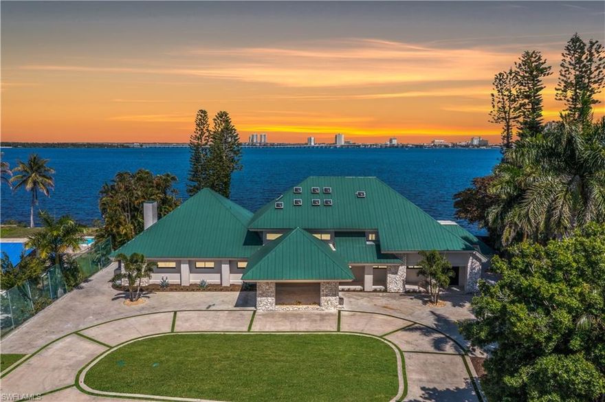 Welcome to 752 Overiver Drive. This stunning estate offers unobstructed panoramic views of the Caloosahatchee River with the Downtown Fort Myers skyline shimmering across the water. Set in the quiet residential enclave of Overiver Shores in North Fort Myers, this fully reimagined waterfront residence offers the rare combination most buyers only dream about: complete privacy and serenity on one side, and one of Southwest Florida's most dynamic urban skylines on the other. Offering 5 bedrooms, a workout room, 5 full bathrooms, and over 6,000 square feet of living space, this estate offers a uniquely expansive layout unlike anything available today. The home has been transformed from the ground up — no compromises, no shortcuts, nothing left unfinished. Completely replumbed with PEX, all new electric panels & wiring, four brand new state-of-the-art HVAC systems & duct work, PGT impact windows & doors, high impact garage doors, and so much more, this home is the definition of move in ready. The design work throughout is unmatched. Step through the front door and the first thing you notice is the staircase. Designed by a world renowned interior designer and hand-fabricated by master craftsman Lawrence Voytek — a collaborator of Robert Rauschenberg — it is a functional sculpture, one born from a genuine creative collaboration. It sets the tone for everything that follows. And everything that follows delivers. The interiors were conceived by an artist from start to finish and exudes Hollywood regency design, creating a sense of flow and intention that moves through every room. Finishes were curated, not selected off a shelf: plumbing by Ferguson, tile and surfaces by ProSource, custom cabinetry crafted by Designs by Distinction, closet systems by Florida Closets, Emtek hardware by Smith & DeShields, lighting and accessories by Lighting First, and luxury appliances from FUSE Specialty Appliances. High-end Berber carpeting and tile floors are throughout. Outside, a resort-caliber pool anchors a professionally landscaped yard with turf that extends to the water's edge. An irreplaceable feature of the back yard is the private boat launch. A fully monitored alarm system, sound system, and Wi-Fi infrastructure are already in place. For this home, there is nothing to renovate, nothing to update, nothing to wait on. Just an exceptionally designed waterfront estate. Where the river is your backyard and the skyline as your view, this property offers more than any other in Southwest Florida.