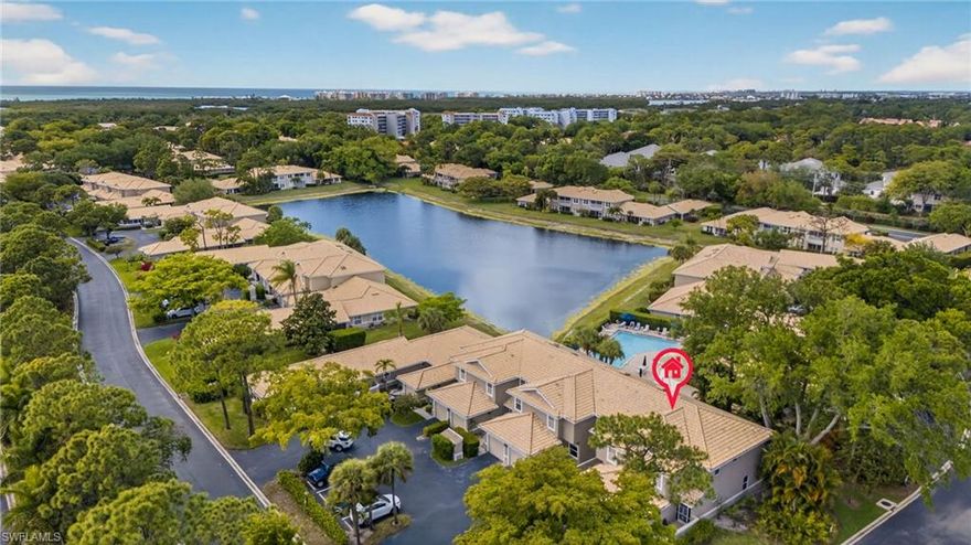 Welcome to your slice of paradise in Villages at Emerald Bay, a gated and vibrant community perfectly positioned west of 41, where lifestyle takes center stage. Known for its welcoming atmosphere, residents enjoy an active social calendar, pickleball and tennis courts, and a lively community pool where friendships from around the world are formed and cherished. This beautifully updated first-floor 2-bedroom, 2-bath residence offers the comfort and convenience of a thoughtfully upgraded kitchen featuring brand-new appliances, complemented by modern, updated flooring throughout (NO CARPET) creating a clean and move-in-ready feel. Offered turnkey furnished, this home allows you to immediately begin enjoying the Naples lifestyle. Location within the community is simply unmatched-just steps from the pool… literally less than 20 steps from your front door, making it effortless to soak in the sun or connect with neighbors at a moment’s notice. Beyond your doorstep, the lifestyle continues. Ideally situated between Wiggins Pass Beach and Barefoot Beach, your days can be filled with coastal escapes, while evenings offer endless options for dining and shopping nearby. And with Mercato just minutes away, you’ll enjoy the perfect blend of community charm and everyday convenience.  This is the perfect opportunity to embrace the effortless, connected, and sun-soaked lifestyle that makes Naples so special.