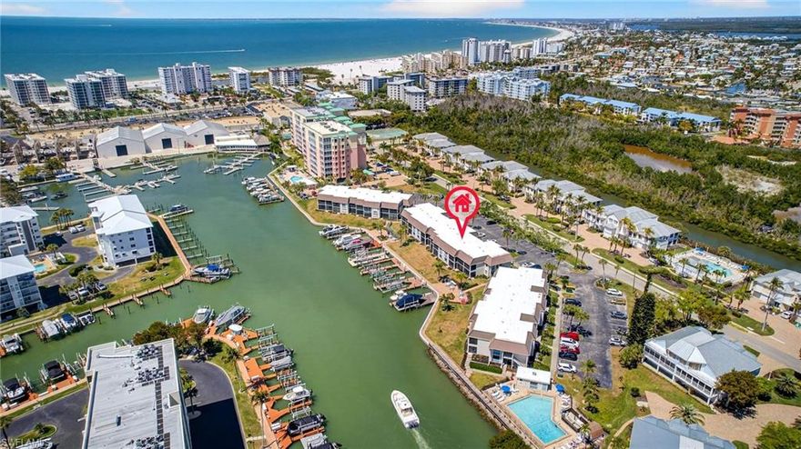 Welcome to a prime opportunity to own on Fort Myers Beach! This RARE TWO Bedroom TWO Bathroom condo at Estero Island Yacht & Raquet Club offers an incredible chance to own property in a desirable and picturesque location. Situated in a vibrant community, this condo provides easy access to the stunning beaches, charming local shops, and delicious dining options that Fort Myers Beach is known for. The Unit is on the top floor and boasts a tremendous view of the intersecting canal and boats and wildlife passing by . Pair all that with weekly rentals and now you have a recipe for success . Community amenities include a heated pool , bike storage , community laundry , and available boat slips or lifts (privately purchased or rented) and endless Florida sights . With a convenient location, you will enjoy the perfect blend of tranquility and accessibility to nearby amenities. Wake up to the sounds of the water and make this yours today!