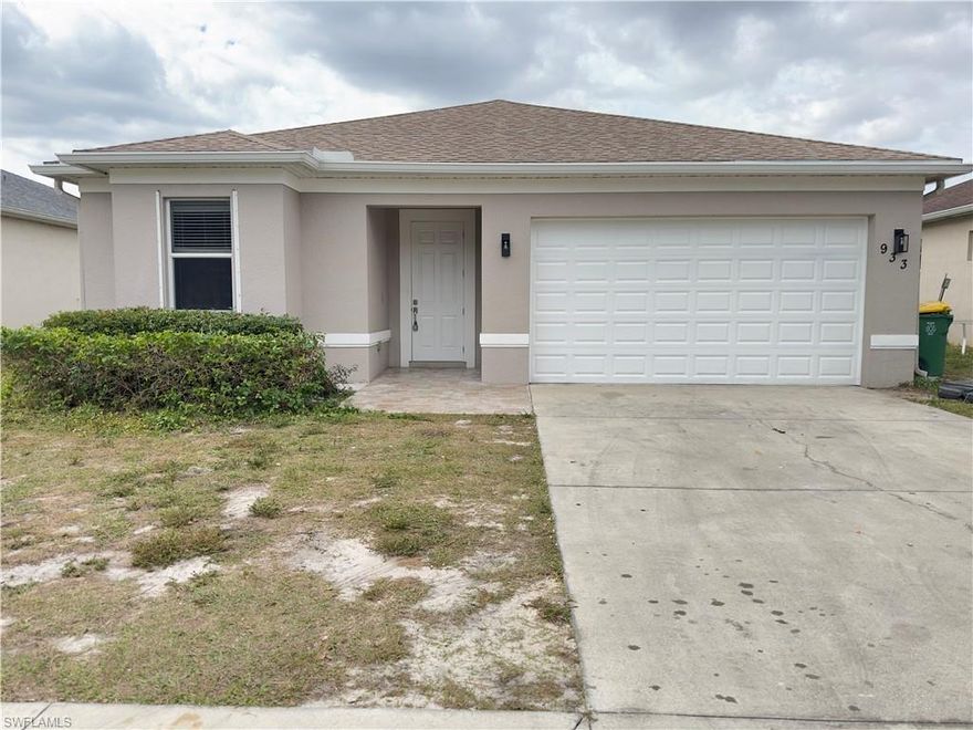 0% down payment financing available for qualified buyers through approved lenders. Welcome to 933 Hamilton St in Immokalee, featuring tile flooring throughout the entire home, hurricane screens for added storm protection, and a peaceful lake view in the backyard. This well-maintained property offers low-maintenance living with durable finishes and a functional layout. Enjoy relaxing water views right from your backyard, perfect for entertaining or unwinding at the end of the day. Conveniently located near schools, shopping, and major roadways. Schedule your private showing today.