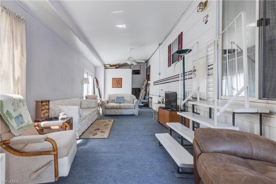 This cute little home has so many possibilities. You will love the location as it is toward that back of the park where it is much more quiet. The owners have recently update the lanai with paint and new indoor outdoor carpet.  There is also a side entry that is perfect for storing your golf cart when you go north. You will immediately see the love that the owners have put into this cute little place. This is one of the few 55 plus communities where you actually OWN the land and the price is just right for the person who doesn't want to break the bank to have a winter home.  You don't want to miss out on this little gem.