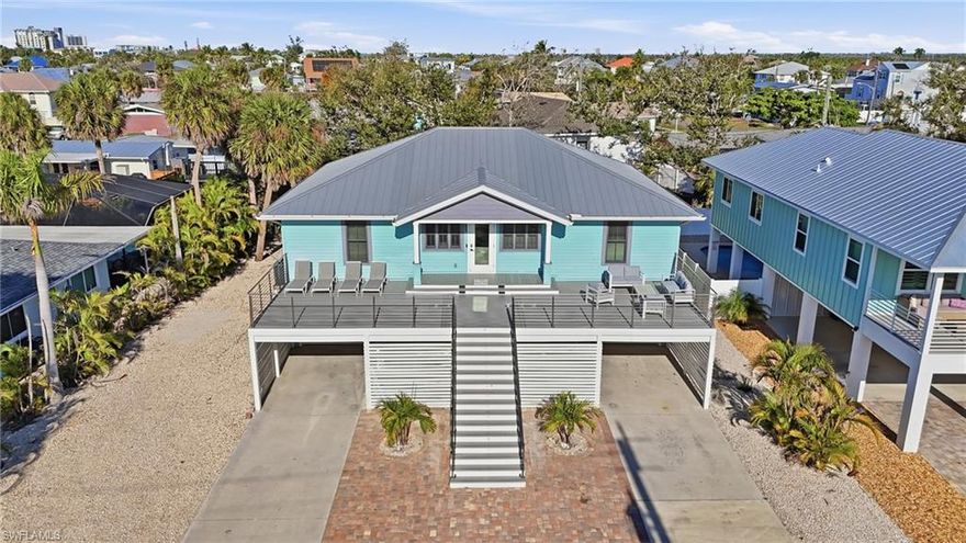 Experience the ultimate in Fort Myers Beach living with this beautifully designed elevated coastal home, just steps from the Gulf with direct beach access. This fully furnished 4-bedroom, 2.5-bath residence is perfect for personal enjoyment or as a high-performing investment, with weekly rentals allowed and a proven rental income of up to $116,856 annually.
The main living area features a bright, open floor plan with soaring ceilings, durable tile flooring, and elegant coastal finishes. The well-appointed kitchen boasts granite countertops, stainless steel appliances, custom cabinetry, and a large island ideal for gatherings. Fully stocked and move-in ready, the home is set up for both owners and guests.
The owner’s suite offers a private retreat with a king bedroom, generous closet space, and an en-suite bath complete with a soaking tub and separate tiled walk-in shower. Three additional guest bedrooms provide comfortable accommodations with flexible sleeping arrangements.
The ground level provides approximately 1,500 sq. ft. of versatile space for recreation, storage, along with a two-car garage.
Outdoor living shines with a heated zero-entry pool, paver deck, and grilling area, creating a private oasis for entertaining or relaxing.
Conveniently located within walking distance to beach access, dining, shopping, and the historic Mound House, and just 1.8 miles from Times Square, this property is professionally managed and enjoys consistent occupancy. A rare opportunity to own a coastal home that delivers both lifestyle and strong investment potential.