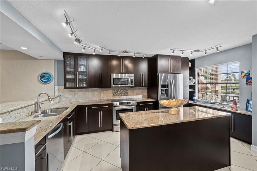 This Stylish TURNKEY furnished two bedroom, two bathroom second floor condo in Naples offers a bright, welcoming space that is truly move in ready. Everything is in place so you can settle in and start enjoying the Florida lifestyle from day one.  The open layout is thoughtfully designed to maximize both comfort and functionality, with a spacious living and dining area that flows effortlessly out to a private screened lanai. It is the perfect place to enjoy a quiet morning coffee or unwind in the evening with peaceful water views and warm Florida sunsets.
The kitchen features a central island that keeps the space both practical and connected, making it easy to cook, gather, and entertain. Both bedrooms are generously sized with ample storage, offering comfort and privacy for you and your guests.
Set within a rare single building community, this residence offers a more intimate and neighborly atmosphere where connections come naturally. Residents enjoy a sparkling pool, lush tropical surroundings, and a low maintenance lifestyle that makes this home ideal as a full time residence or a seasonal retreat.
Located just minutes from Naples’ renowned white sand beaches, exceptional dining, world class golf courses, and upscale shopping, this is an opportunity to enjoy the very best of Southwest Florida living in a setting that feels both relaxed and refined.