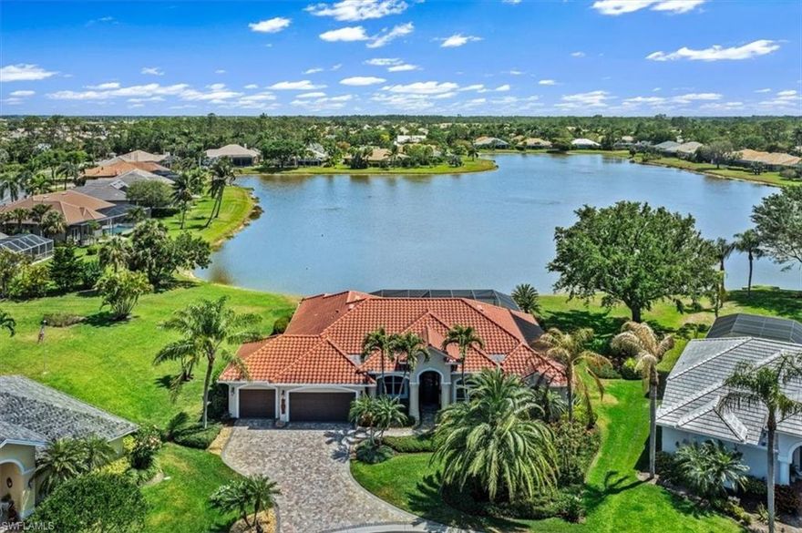 H9665 - Oh what a view!  With over 200 feet of lake frontage, the sparkling water views capture your attention from every room.  This updated home has 3 bedrooms plus a den and 3 full baths.  Large neutral tile flows throughout most of the home.  The open and spacious kitchen has high end finishes and walls of glass perfectly blending the natural surroundings.  All the sets of sliders disappear behind walls creating a special ambience throughout this home.  The den is situated away from the activity but still encompasses the lake views.  The owner's suite has 2 California walk-in closets and Luxury finishes in the upscale bath.  Custom features and built-ins are found throughout.  Topping off a long list of upgrades and special features is the 3 car air conditioned garage with tons of custom cabinetry and ceiling racks for amply storage.  The salt water pool and spa have both solar and electric heat.  The hand held remote allows you to control the temperature and spa levels while lounging on the paver lanai watching the birds fish and swim through the picture screen.  This is the quintessential Florida Lifestyle.