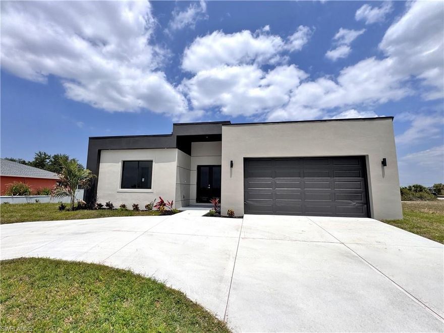 Discover this stunning, move-in-ready new construction home offering 1,904 sq ft of living area located in the fastest-growing area of Cape Coral. Featuring a sleek contemporary layout with 10-foot ceilings and elegant tile flooring throughout, this residence boasts 4 spacious bedrooms and 3 stylish bathrooms. Enjoy a gourmet kitchen with white cabinetry, quartz countertops in both the kitchen and bathrooms, and stainless steel appliances. Bathrooms feature frameless glass-enclosed showers, adding a luxurious touch. A washer and dryer are also included for your convenience. The open floor plan seamlessly connects living, dining, and kitchen areas, while the private backyard offers a peaceful retreat. Built with Stem Wall foundation for enhanced elevation and structural strength, this home also features impact-resistant windows and doors, automatic garage door, irrigation system, and high-end finishes throughout. This property is ideal for families, snowbirds, or investors. Plus, it includes a builder’s warranty 1-2 years and 10-year structural coverage offering peace of mind for years to come. Don’t miss this incredible opportunity to own a high-quality home in a booming location!- It comes with blinds, shelves and filter