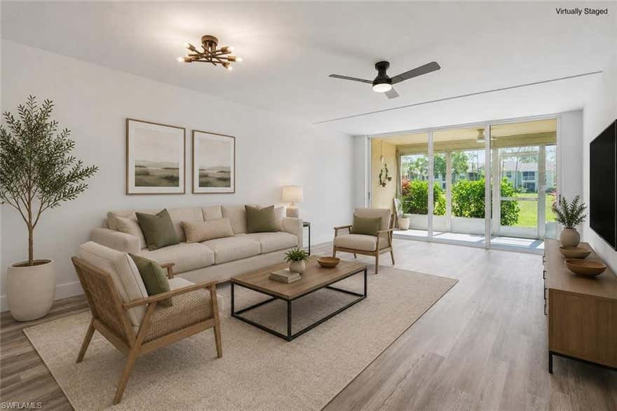 One or more photo(s) has been virtually staged, AI generated or rendered.  Beautifully renovated first-floor 2-bedroom, 2-bath condo overlooking the golf course in the heart of Naples. This light and bright 1,000 sq. ft. residence has been thoughtfully updated from top to bottom with quality finishes and modern design throughout.

Recent renovations include all new electrical, luxury vinyl flooring, updated lighting and ceiling fixtures, fresh interior paint, new drywall, and the removal of popcorn and drop ceilings for a clean, contemporary feel. The fully renovated kitchen features brand-new Samsung appliances, soft-close custom cabinetry, quartz countertops, and a new kitchen sink. Both bathrooms have been beautifully updated with modern finishes and lighting, while new interior doors and trim add a polished touch throughout the home.

Enjoy peaceful golf course views from this ideally situated first-floor unit, just steps from the community pool. Centrally located in Naples, you are only minutes from world-class beaches, shopping, dining, and downtown Naples.