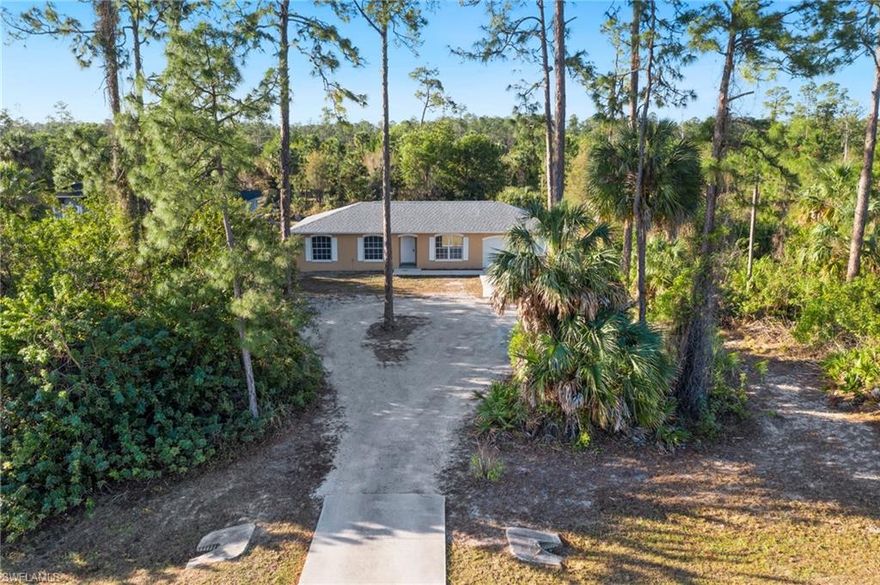 3/2 bath block home located close to amenities in the estates.  Located on 1.59 acres- you can drive next to the house to access your backyard.  Great rental or home for a new homeowner.