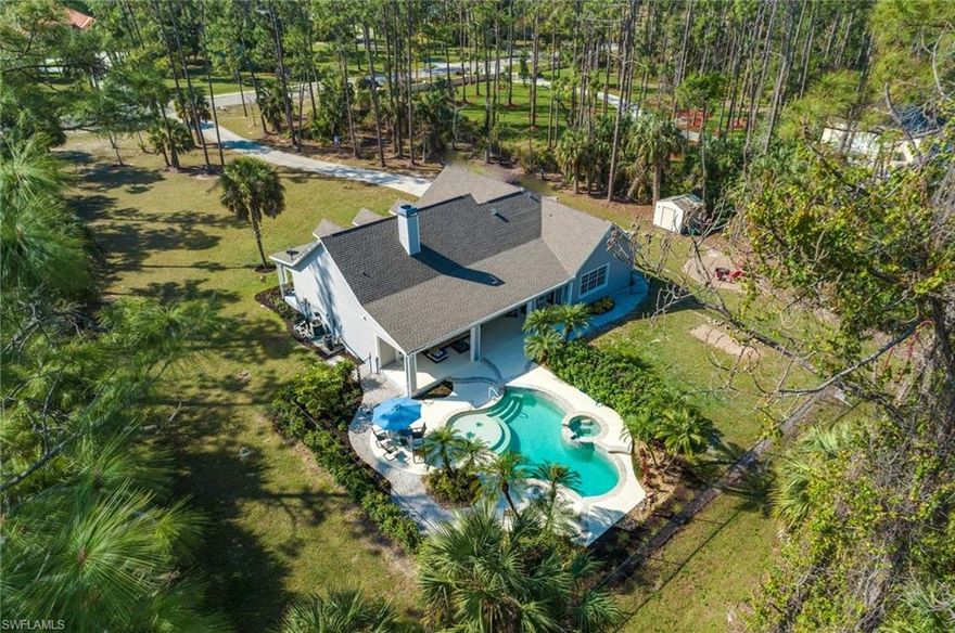 Welcome to your new home!  CITY WATER! NO WELL WATER! This beautiful 4 bedroom 2 bath pool home is situated on 2.33 acres of land is located on the edge of Golden Gate Estates...giving you the best of both worlds, proximity to beaches, shops and restaurants and privacy/space for you family.  Walking distance to Max Hosse Jr Community Park and Big Cypress Elementary School.  Enjoy the Brand new roof, open air pool and spa, fire pit, large covered lanai and huge yard!  The home boasts brand new bathrooms, new HVAC, painting and landscaping.  Move in ready and waiting for you!