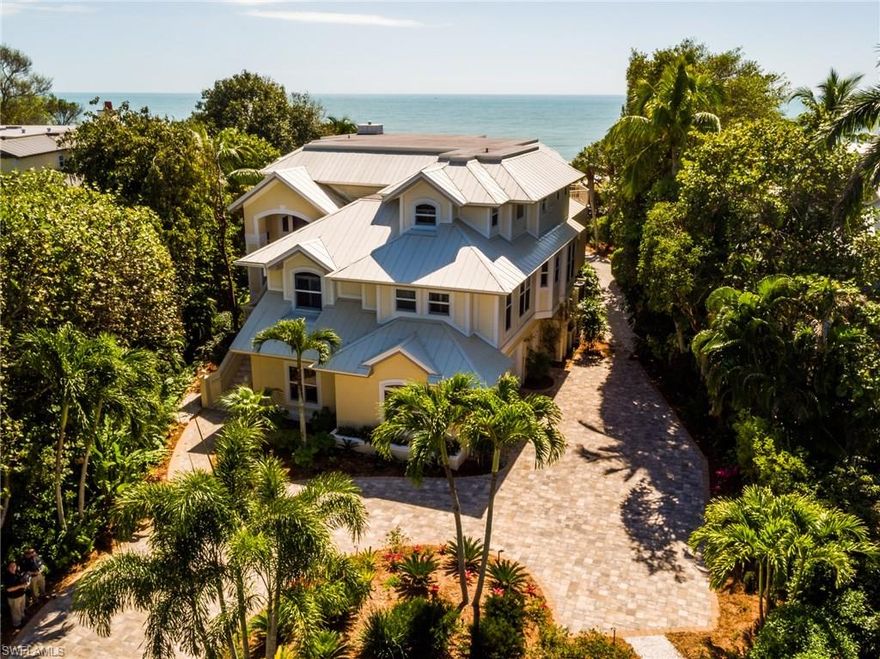 Located on a high ridge towards the end of West Gulf Drive on one of the widest beaches on Sanibel. This gracious Olde Florida style home has breathtaking views, 5 bedrooms, and 6 bathrooms, great room with soaring ceilings, fireplace, and built-ins.  The gourmet kitchen features commercial grade gas oven, warming ovens, wine cooler, large center island, custom cabinetry and dining area overlooking the Gulf.  All bedrooms offer en-suite bathrooms with one being used as a den with custom built-ins, master retreat has gulf-front deck, his and her bathrooms, large closets and private laundry. Beautiful screened lanai and sundecks, marble and wood flooring, detailed mouldings and lighting, huge laundry room, art niches. Custom pool with spa and waterfall. Totally wind mitigated, generator, 3-stop elevator, newer metal roof, concrete pilings, finished lower level, Walsh landscaping, paver driveway and walkways. Meticulous home on prestigious West Gulf Drive.