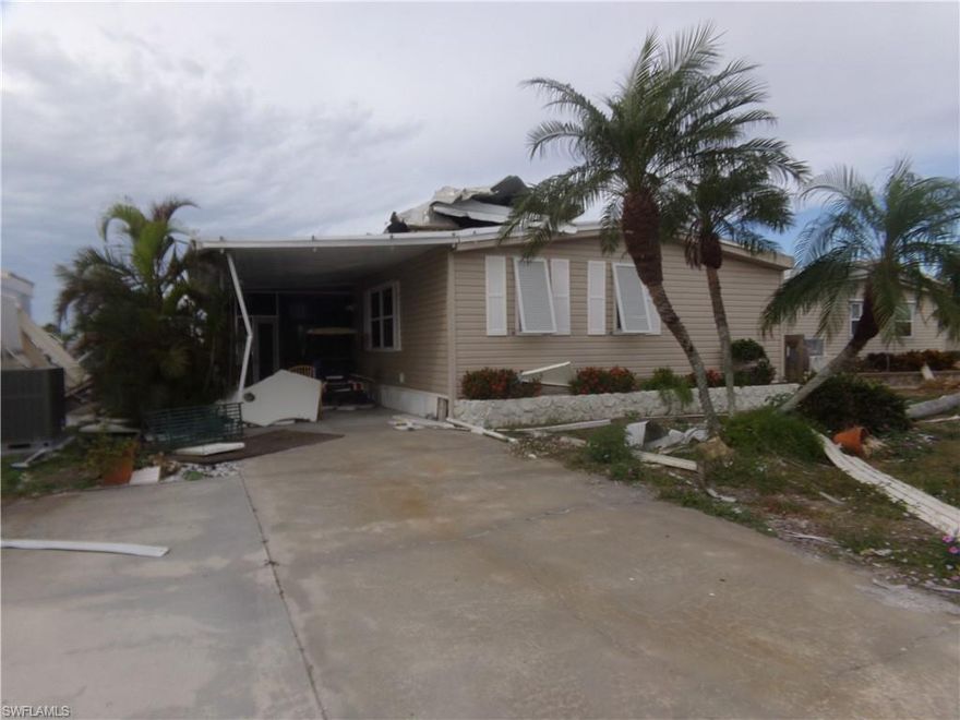DO NOT ENTER HOME IT WAS SEVERELY DAMAGED BY HURRICANE IAN AND IS BEING SOLD FOR LESS THAN ITS LAND VALUE.  SELLERS BELIEVE THERE IS NOT ROOF DAMAGE TO MAIN HOUSE!